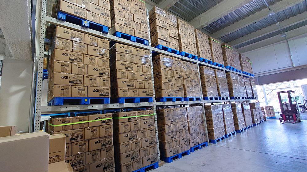 Worker walking in large warehouse
